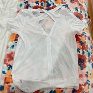 White ivivva shirt cool design in the back